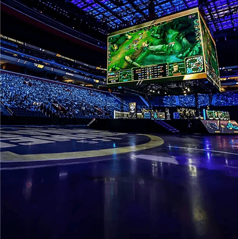 Esports arena with a crowd and a large game screen
